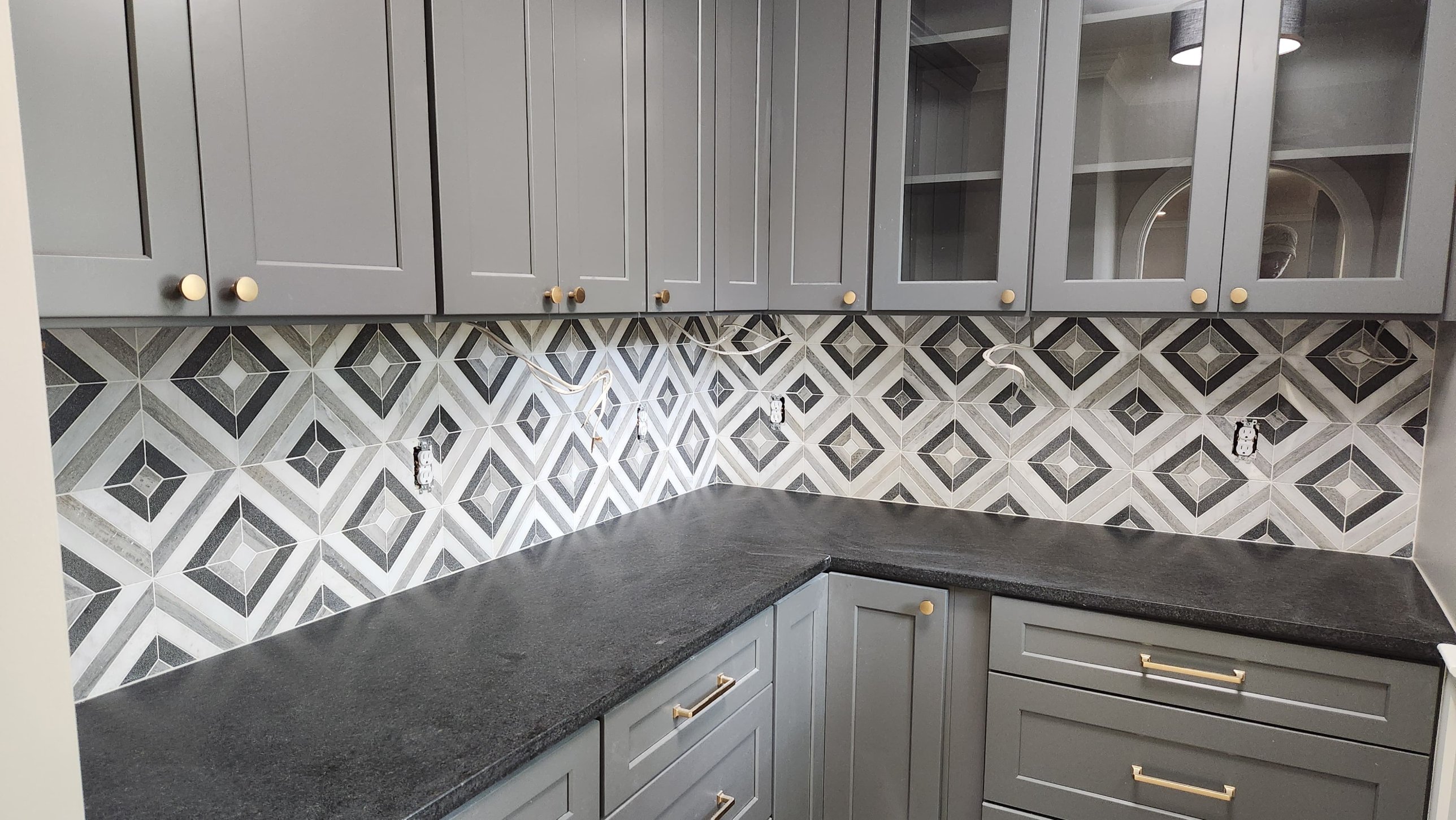 Geometric marble mosaic kitchen backsplash